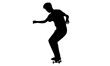 silhouette of a teenager playing skateboard