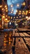 Cozy Nightlife Atmosphere at Illuminated Outdoor Bar with Beer Glasses on Wooden Table