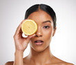 Lemon, skincare and portrait of woman in studio with natural organic and healthy facial treatment. Beauty, wellness and person with citrus fruit for vitamin c for dermatology by gray background.