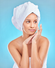 Poster - Skincare, beauty or Indian woman with towel in studio facial glow with natural dermatology cosmetics. Morning, blue background and face of girl model thinking of health ideas, cleaning or wellness