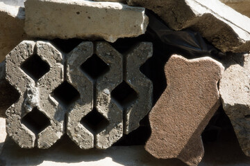 gray blocks concrete brick blocks on the ground construction isolated stack.