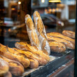 Breads in a bakery window.