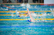 Race of backstroke swimmers in the pool 