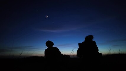 Wall Mural - people observing night skies with moon, stars, planets and other celestial wonders.