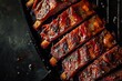 Ribs are grilled on a black grill.