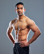 Portrait, man and fitness for muscle in health, wellness and workout in studio background for sports training. Male person, athlete and strong for progress as bodybuilder for results in grey backdrop