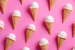 Pattern from ice cream in waffle cones. Pink background, minimalistic flat lay.