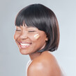 Happy, black woman and makeup with shade of foundation for cosmetics, color or skin tone on a white studio background. Face of African, female person or model with smile in satisfaction for beauty