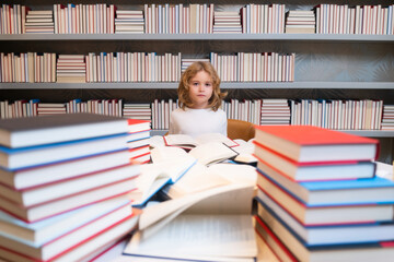 Aufkleber - School boy. School kid with pile of books. Children enjoying book story in school library. Kids imagination, interest to literature. Kids smart activity. Child study read book in classroom.