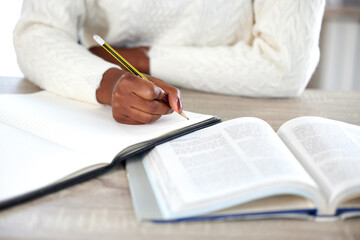 Poster - Woman, hands and book for writing notes in home, research and student for plan in journal. Female person, ideas and textbook for university or college education, study and knowledge for exam or test