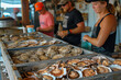 Busy Seafood Market Scene. Workers sorting and preparing fresh oysters for sale.