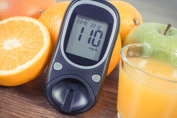 Wall Mural - Glucometer, fresh fruits and orange juice. Healthy lifestyle and nutrition containing minerals and vitamins during diabetes