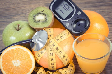 Wall Mural - Glucose meter for checking sugar level, fresh fruits and orange juice. Healthy lifestyle and nutrition during diabetes