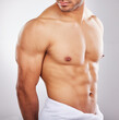 © peopleimages.com - Abs, towel and fitness in studio, person and health of body with workout, exercise and gym. Sports, athlete and bodybuilder with muscle, strong and wellness for abdomen, model and white background