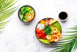 Fototapeta Na sufit - Balanced food nutrition. Poke bowl with shrimp, rice, avocado, vegetables and chuka salad, white table background, top view