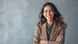 © volga - Confident businesswoman smiling in professional attire with crossed arms