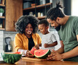 © Lumos sp - child family kitchen food boy son father mother watermelon fruit slice summer organic meal fun preparing healthy diet eating home black