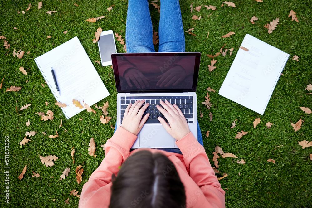 Student, laptop and notebook on grass for learning, research and ...