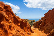 Amazing red sandstone rocks of the cliffs near Praia dos Paradinha, Albufeira, Algarve, Portugal