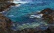 Blue Atlantic ocean water, cliffs and waves near Buenavista del Norte,Tenerife,Canary Islands,Spain.