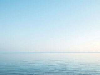 Wall Mural - tranquil sea under a clear sky at dawn, with gentle ripples and a soft gradient from blue to light o