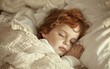 Young child sleeping peacefully in soft white bedding.