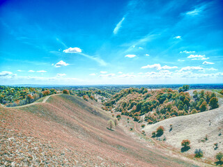 beautiful green rural outdoor scenery with bright blue sky and hills