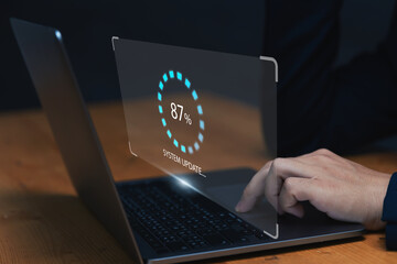 Fototapete - Businessman updating computer system for device operating system to be up to date with new version. Graphics icon showing updating function screen loading on computer laptop.