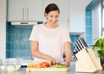 Poster - Cooking, home and woman in kitchen with vegetables for meal prep for dinner, supper and lunch. Recipe, eating and happy person with ingredients on counter for wellness, nutrition and healthy detox