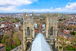 City of York, England from atop York Minster. Above view through the historic church spires during spring.