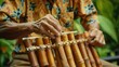A man is skillfully playing the angklung a unique multitonal musical instrument that originated from the Sundanese culture Crafted from bamboo the angklung produces enchanting melodies that