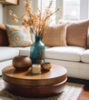© MrMachyH - Close up of a coffee table in a living room with a beige sofa and brown pillows.