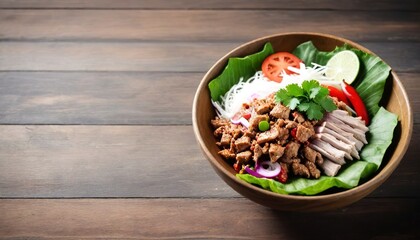 Wall Mural - Thai cuisine spicy pork salad on wood background or Yum Moo Yor