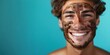 Young man with a coffee scrub mask showcasing a radiant smile. Concept Skincare Routine, Self-care Products, Male Grooming, Facial Treatments, Radiant Skin