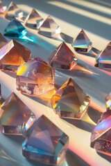 Poster - Conceptual artwork showing a series of small prisms creating overlapping rainbows on a white canvas,