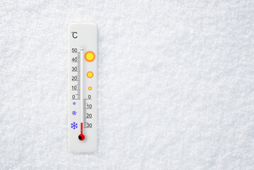 Wall Mural - White celsius scale thermometer in snow. Ambient temperature minus 25 degrees celsius