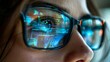 © tanapat - Closeup of the eyes and glasses reflecting digital technology