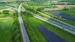 © Michael - Drone view of a highway in Germany with a lot of traffic and many green fields around it.