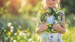 A young girl stands outdoors holding a vibrant wreath of meadow flowers against a sunny backdrop of nature This floral adornment is a traditional decoration for Summer Solstice Day Midsumme