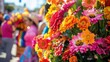 Colorful flowers are displayed on the street for the Corpus Christi parade