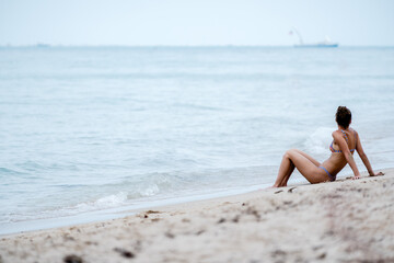 Wall Mural - woman relaxing on beach