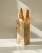 French baguette in paper bag on white table for fresh baked bread display or breakfast concept