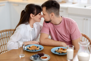 Sticker - Lovely couple spending time together during breakfast at home