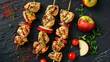 Chicken skewers with slices of apples and chili.