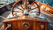 Classic, round yacht steering wheel on a wooden hull, close-up.