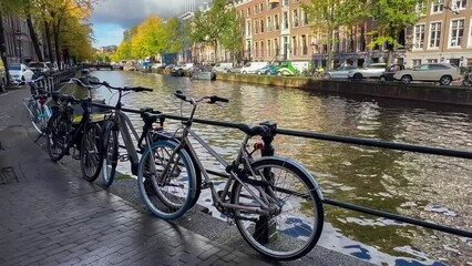 Wall Mural -  Amsterdam autumn cityscape narrow old houses, canals, boats Amsterdam, Netherlands September 20, 2023. High quality 4k footage