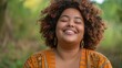© progressman - a woman with curly hair smiling