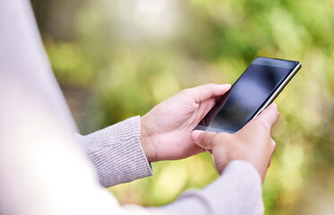 Poster - Outdoor, hands and woman with smartphone, nature and typing with social media, screen and connection. Closeup, person and girl with cellphone, mobile user and internet with online reading and app