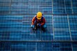 © ZeNDaY - A dramatic overhead view of a large solar panel field, with a technician performing maintenance
