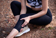 © peopleimages.com - Hands, knee pain and injury outdoor from accident, workout or training for health in nature. Legs, muscle problem or person with arthritis, fibromyalgia or medical osteoporosis after fitness exercise